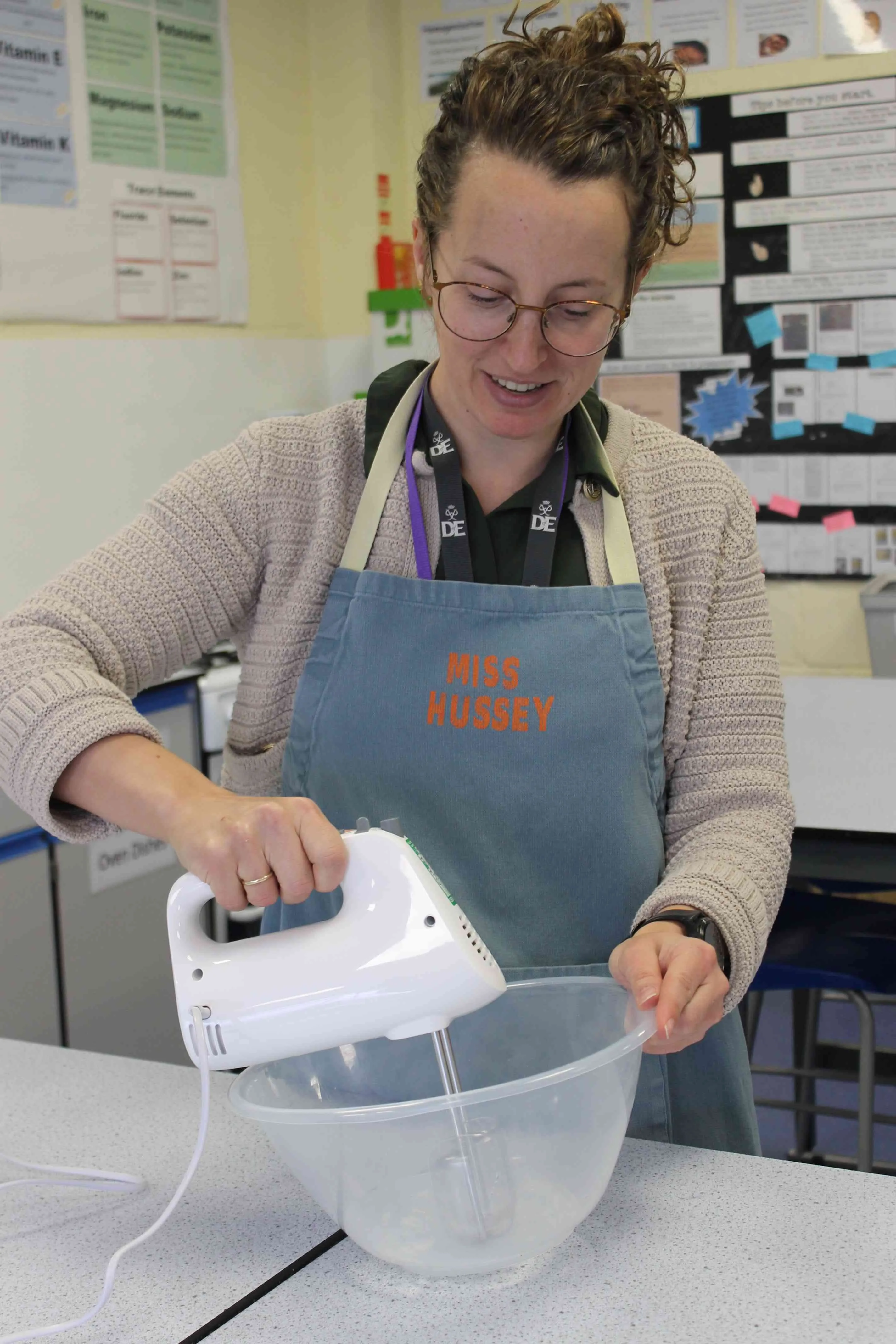 Students using the new hand mixers in a Food Tech class